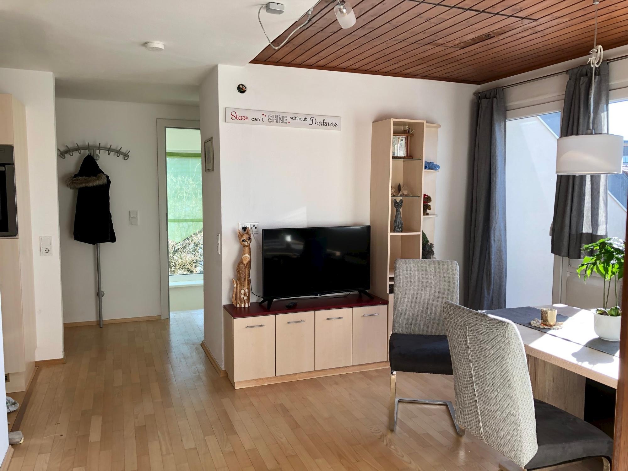 the center of the apartment is an open dining-kitchen area form which all other rooms branch off