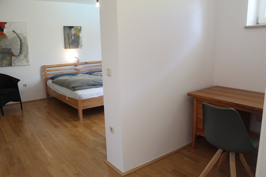 Master bedroom with work space and large bathroom