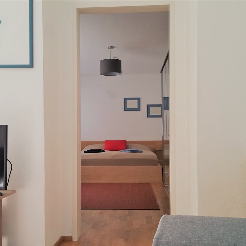 View from the living room into the bedroom