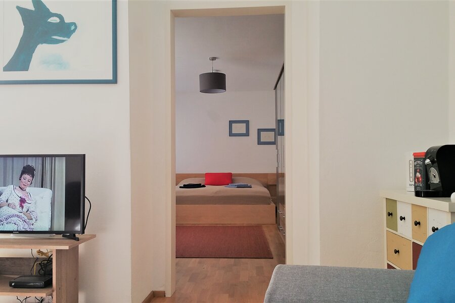 View from the living room into the bedroom