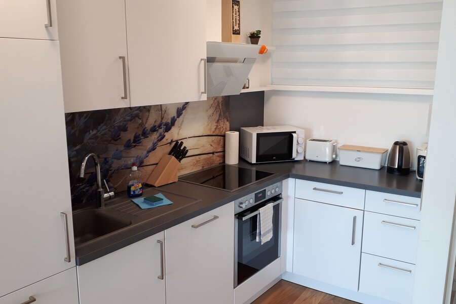 fully equipped with all dishes and kitchen appliances