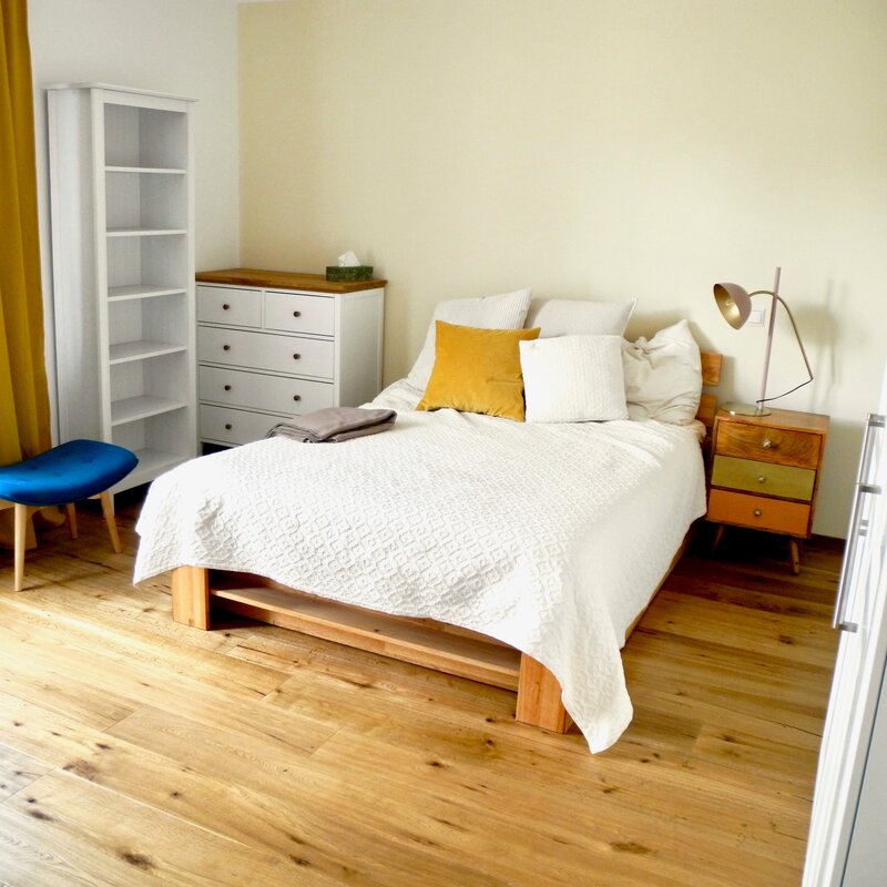 bedroom with bed, nightstand, dresser and shelf | © Tillbert Strahl
